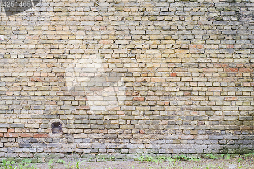 Image of colorful abandoned grunge cracked brick stucco wall