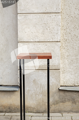 Image of outdoor table near the stucco grunge wall