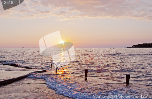 Image of Spectacular sea sunset from the beach of the naturist camping of Cervar Porec (Parenzo), Istria, Croatia