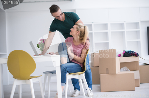 Image of Young couple moving in a new home