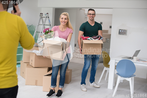 Image of young couple moving into a new home