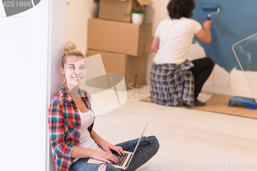 Image of Happy couple doing home renovations