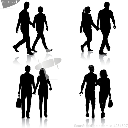 Image of Set Silhouette man and woman walking hand in hand