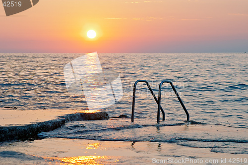 Image of Spectacular sea sunset from the beach of the naturist camping of Cervar Porec (Parenzo), Istria, Croatia