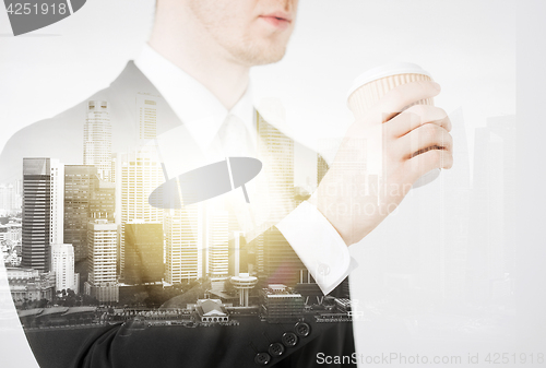 Image of close up of businessman drinking take away coffee