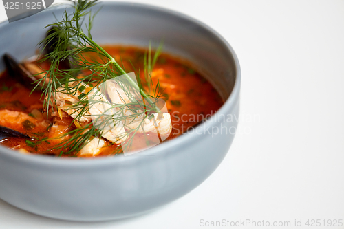 Image of close up of seafood soup with fish and mussels