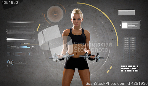 Image of happy young sporty woman exercising with dumbbells