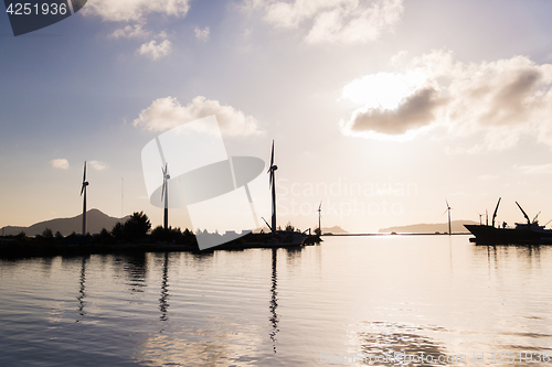 Image of turbines at wind farm on sea shore