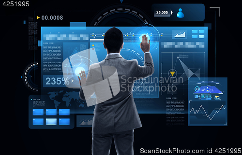 Image of businessman working with virtual reality screens