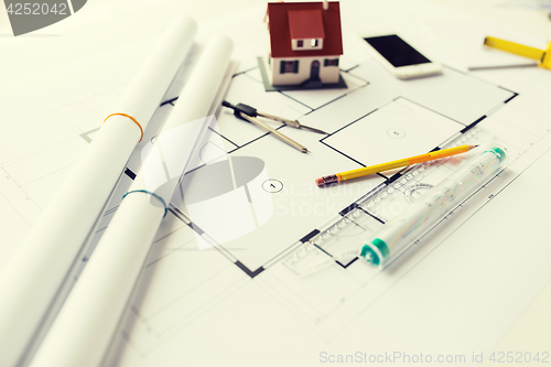 Image of close up of architectural blueprint and tools