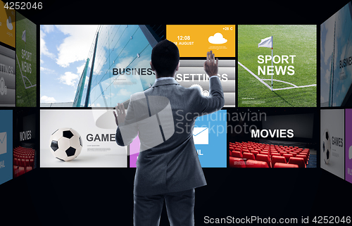 Image of businessman working with news applications