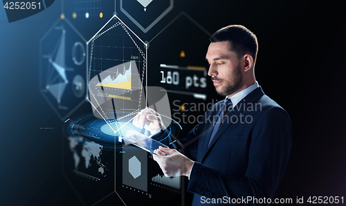 Image of businessman with tablet pc and virtual projection