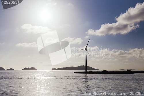 Image of turbines at wind farm on sea shore