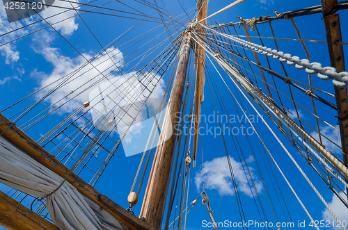 Image of Folded sail and mast on an old sailboat