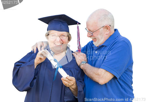 Image of Senior Adult Woman Graduate in Cap and Gown Being Congratulated 