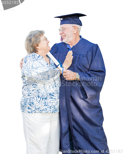 Image of Senior Adult Man Graduate in Cap and Gown Being Congratulated By