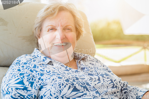 Image of Pretty Senior Woman Portrait on Patio.