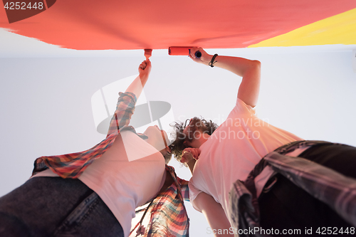 Image of couple painting interior wall