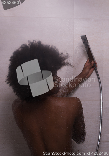 Image of African American woman in the shower