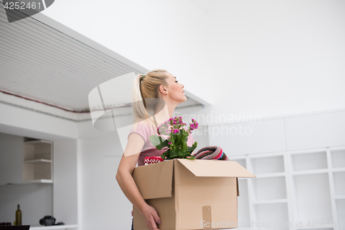 Image of girl moving in the new apartment