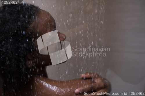 Image of African American woman in the shower