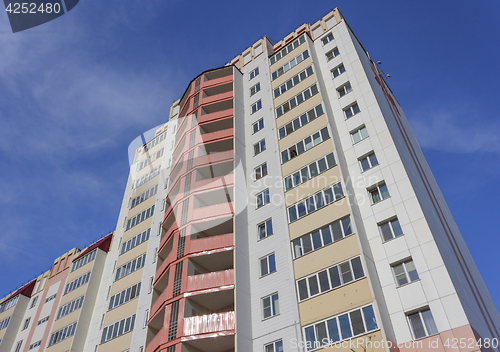 Image of Top of high rise building on blue sky