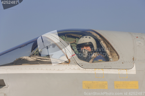 Image of Military pilot in the cockpit of a jet aircraft