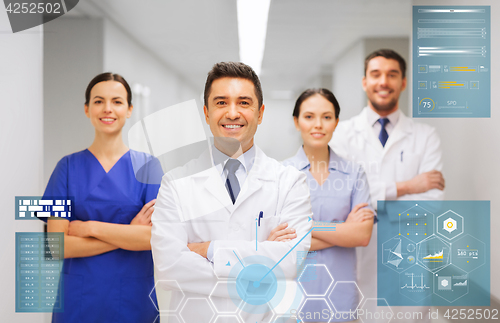 Image of happy group of medics or doctors at hospital