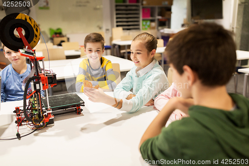 Image of happy children with 3d printer at robotics school