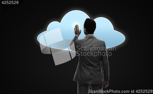 Image of businessman working with virtual cloud projection