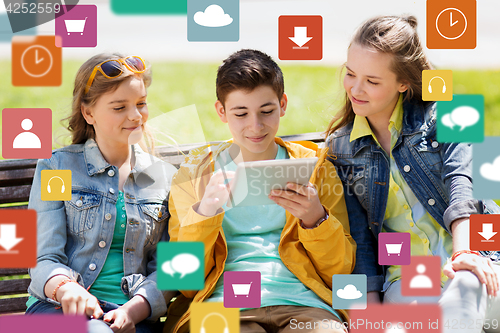 Image of happy teenage friends with tablet pc outdoors