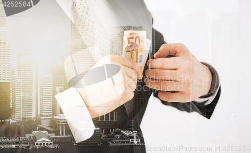 Image of close up of businessman with euro money