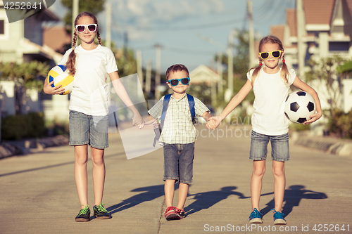 Image of Happy children standing on the road