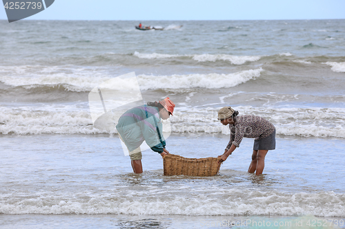 Image of Native Malagasy fishermen fishing on sea, Madagascar