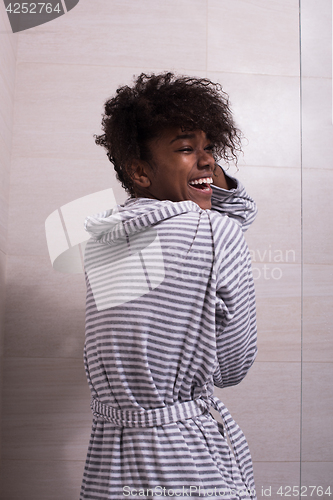 Image of beautiful black woman wearing  bathrobe