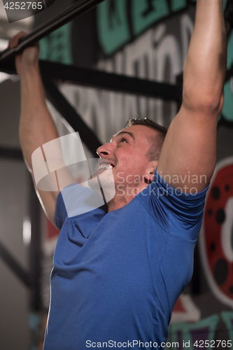 Image of man doing pull ups