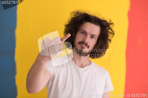 Image of young man with funny hair over color background