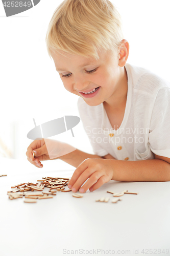 Image of Wooden puzzle. Letters, educational puzzle.