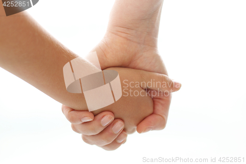 Image of Mother holding a baby&#39;s hand.