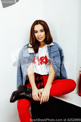 Image of young pretty teenage hipster girl posing emotional happy smiling on white background, lifestyle people concept closeup