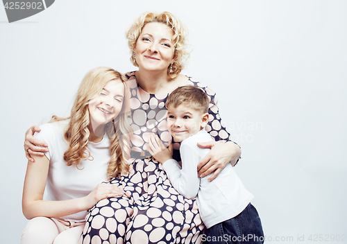 Image of happy smiling family together posing cheerful on white background, lifestyle people concept, mother with son and teenage daughter isolated