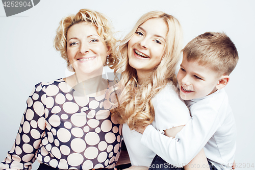 Image of happy smiling family together posing cheerful on white background, lifestyle people concept, mother with son and teenage daughter isolated