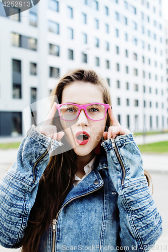 Image of young pretty hipster girl student with coffee cup posing adorable smiling, lifestyle people concept outdoor