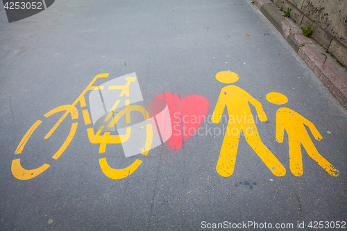 Image of Bicycle signs painted on asphalt