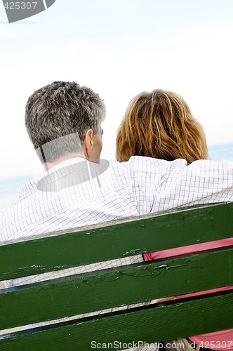 Image of Mature romantic couple on a bench