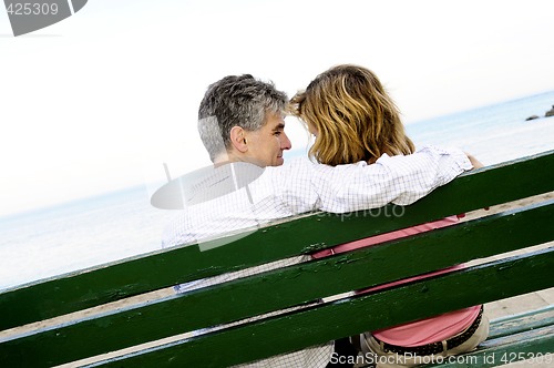 Image of Mature romantic couple on a bench