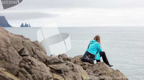 Image of Young woman enjoying the Icelandic landscape