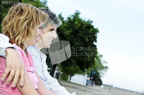 Image of Mature romantic couple on a bench