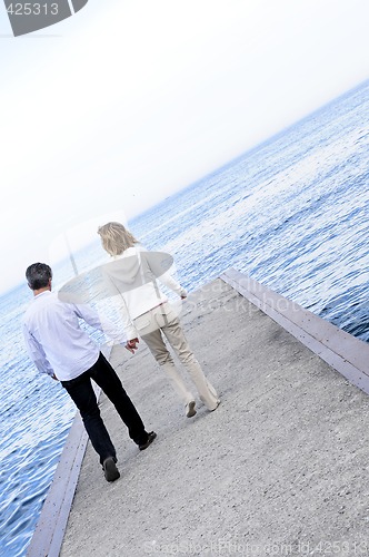 Image of Mature romantic couple on a pier