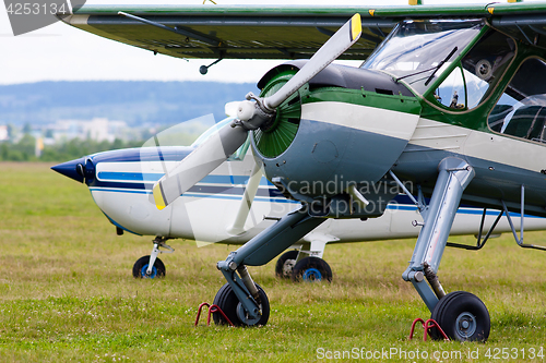 Image of two airplanes on the airfield